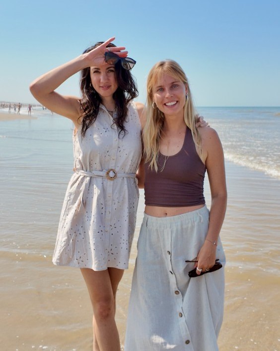 Ianna and Sofie standing together on the beach